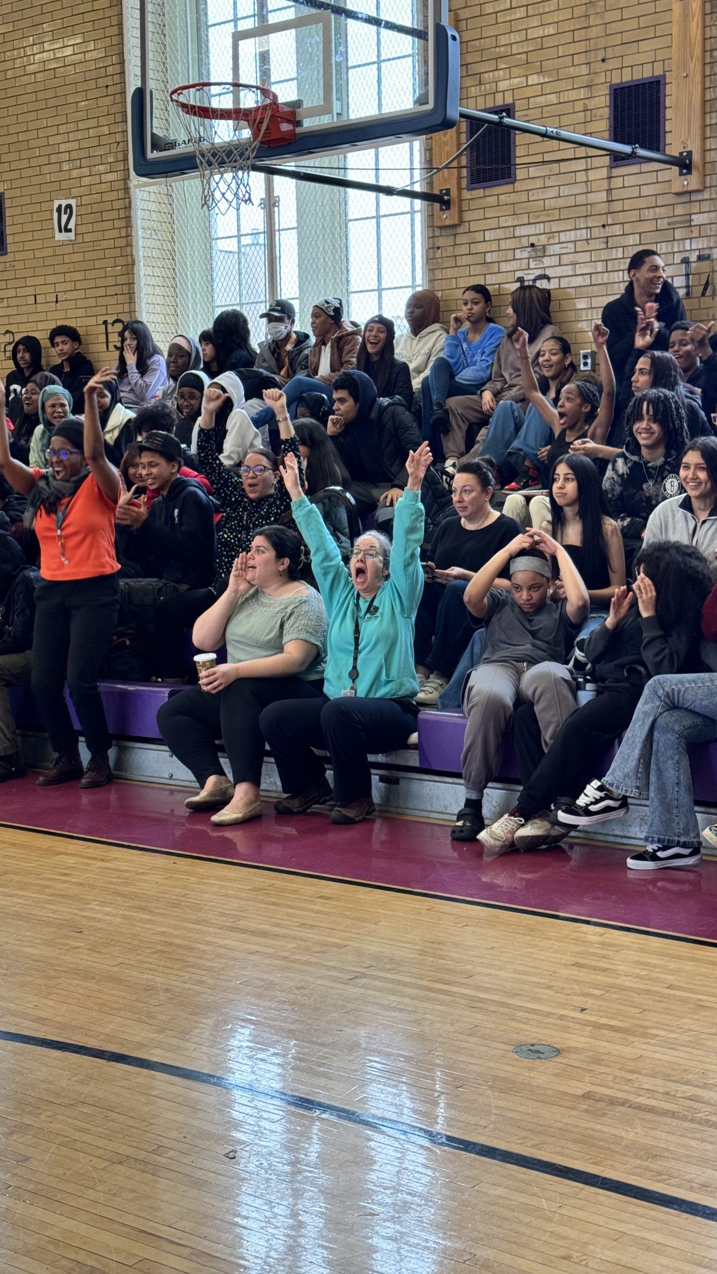 Faculty Cheering at the staff vs seniors game